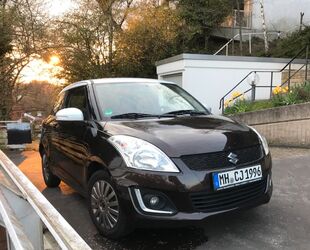 Suzuki Suzuki Swift 1.2 30 Jahre braun/weiß Gebrauchtwagen